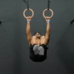 Tucked front lever raises on rings